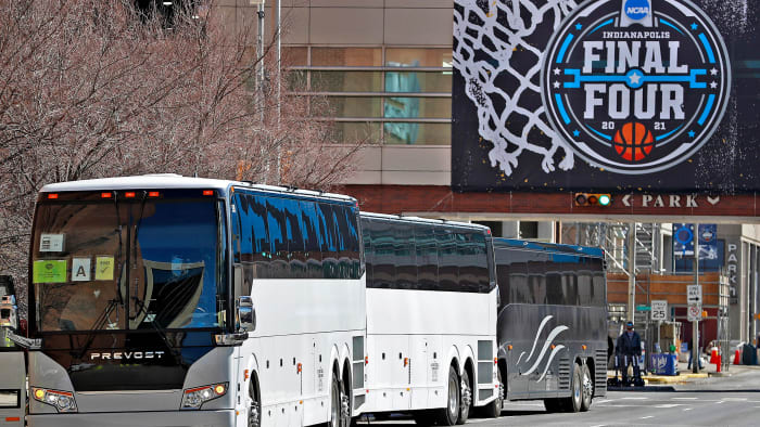 Buses line up to transport teams during the men's NCAA tournament